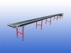 Interroll transportband met 43 cm bandbreedte, 15,5 meter lengte en verstelbare ondersteuningen in hoogte