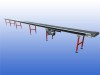 Interroll transportband met 43 cm bandbreedte, 15,5 meter lengte en verstelbare ondersteuningen in hoogte