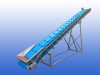 RVS opvoerband van 8,5 meter met meenemers om de 400 mm, invoerhoogte 650 mm en uitvoerhoogte 4,1 meter