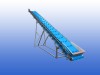 RVS opvoerband van 8,5 meter met meenemers om de 400 mm, invoerhoogte 650 mm en uitvoerhoogte 4,1 meter